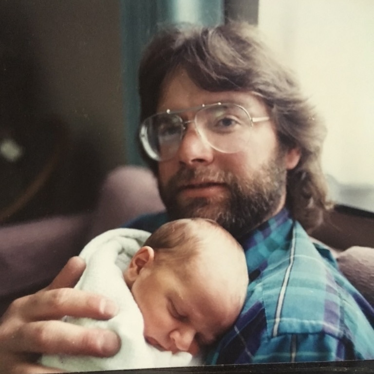 Dad holding me as a baby